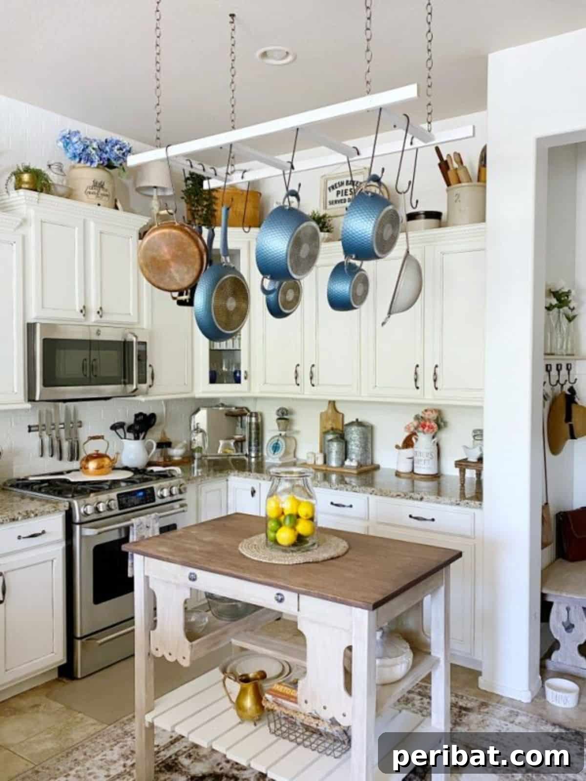 43 Brilliant DIY Pot Rack Projects 24 Chic DIY ladder pot rack created for under $50, enhancing kitchen storage.