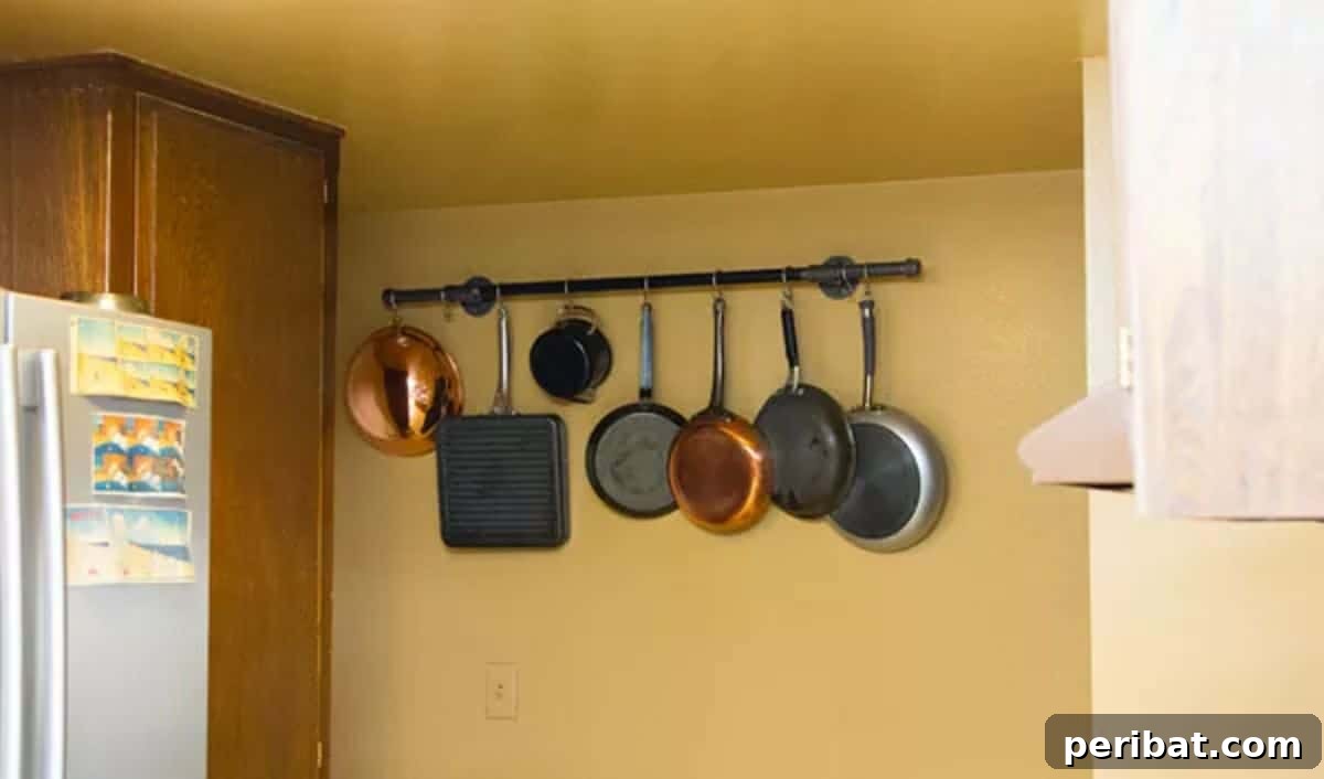 43 Brilliant DIY Pot Rack Projects 26 Chic DIY pot rack using pipes from Home Depot for stylish kitchen organization.