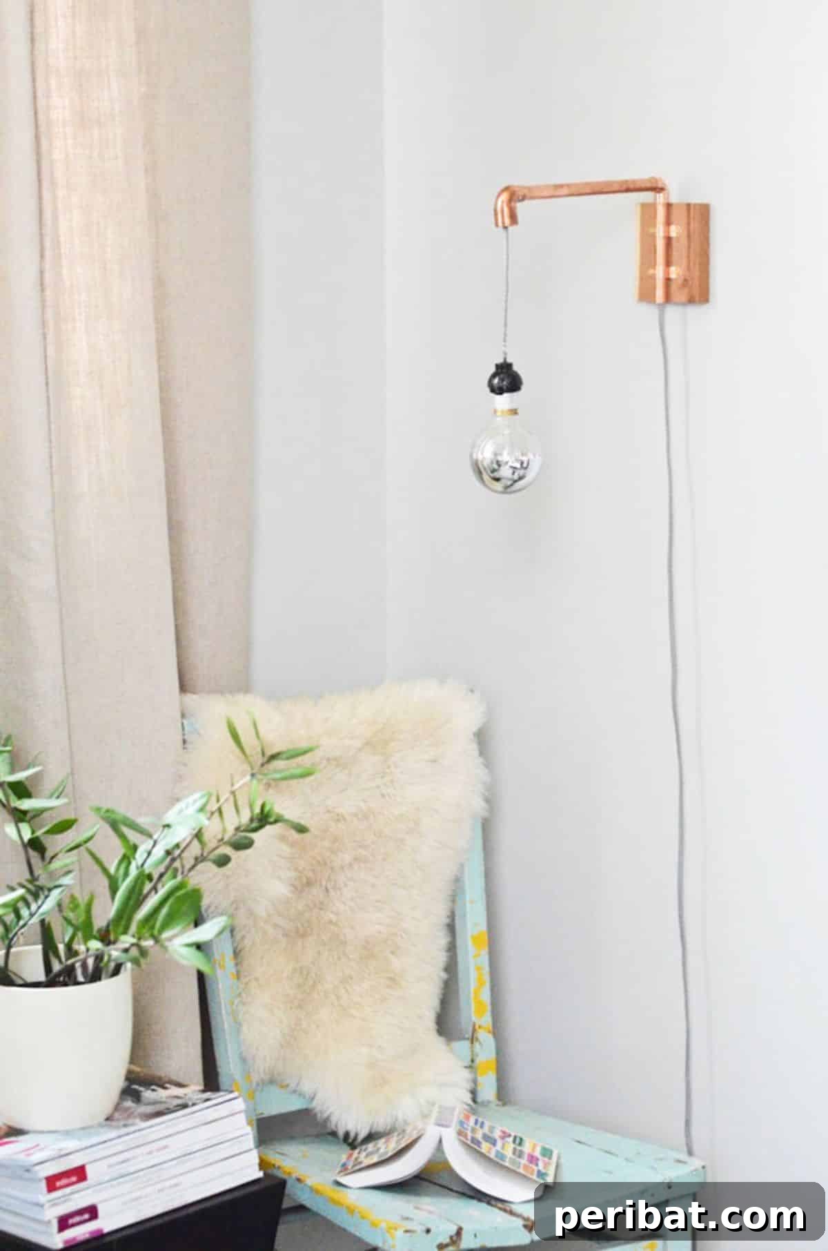 Industrial chic DIY copper pipe wall sconce for modern indoor lighting.