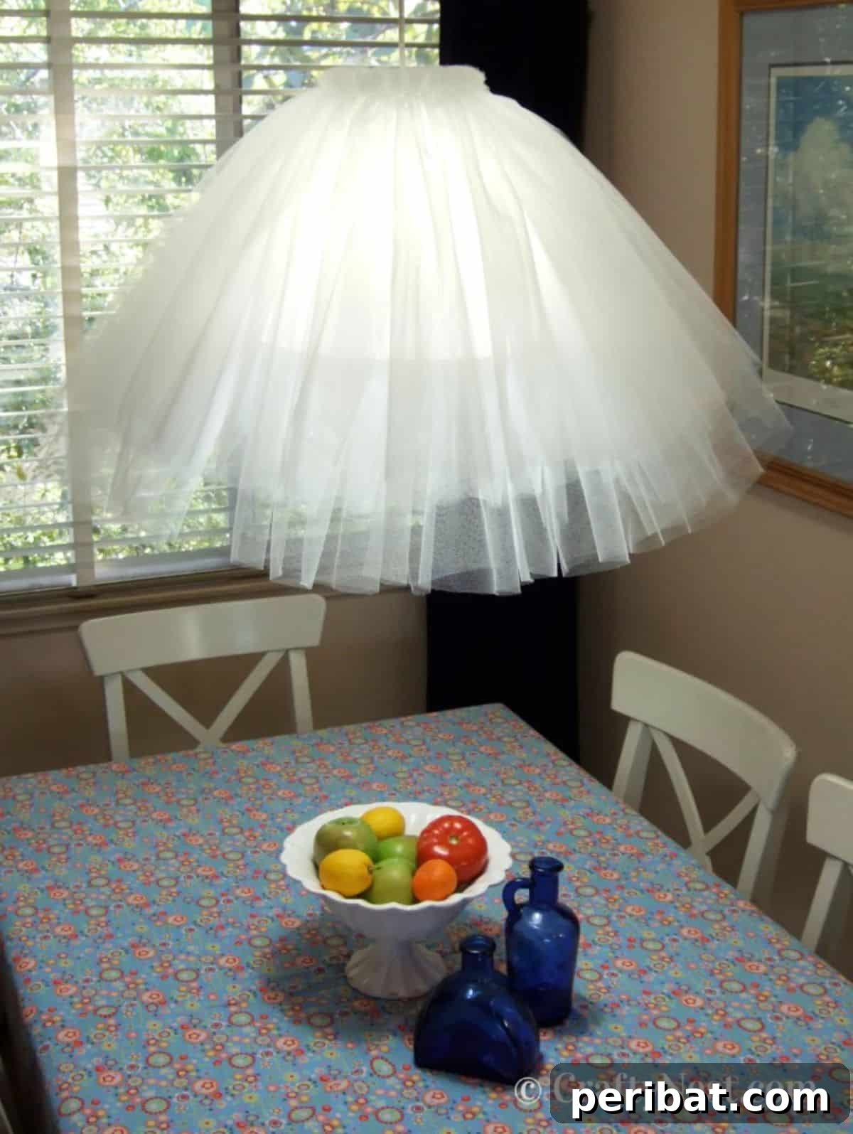 Whimsical DIY tulle tutu pendant lamp for elegant indoor lighting.