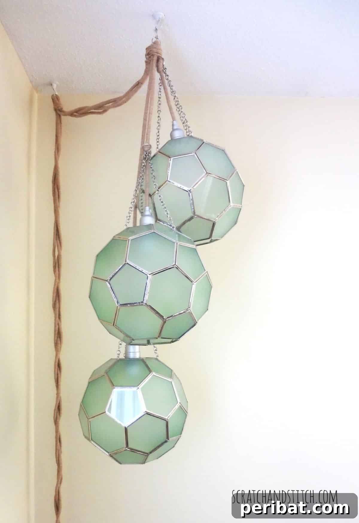 Artistic DIY honeycomb globe pendant light for modern home decor.