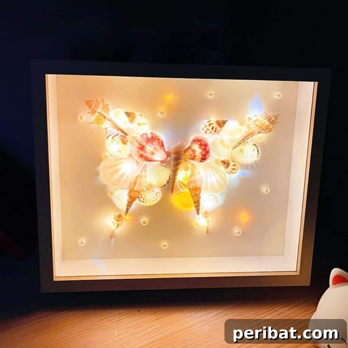 Dreamy DIY battery-operated shell frame night light for beach-inspired decor.