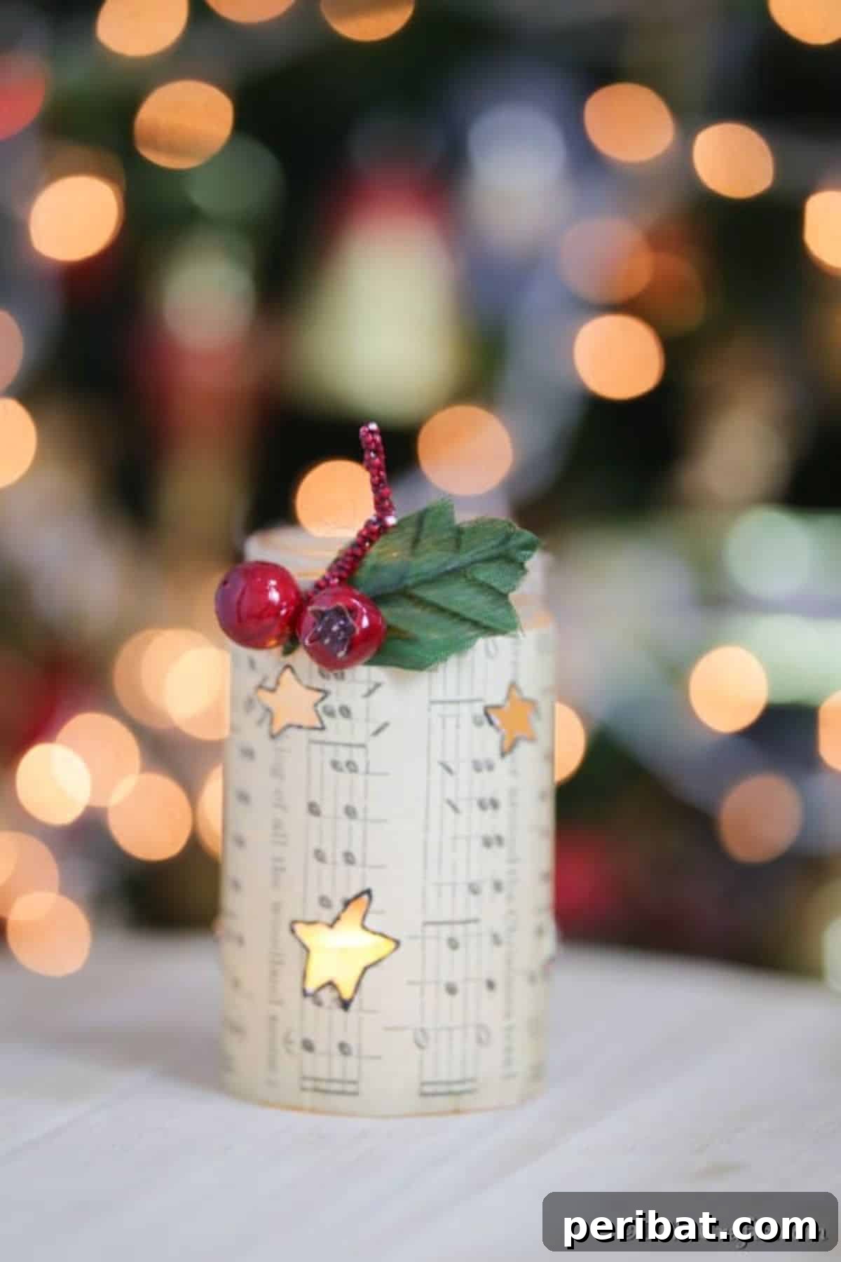 Handmade rustic music sheet lantern for a charming Christmas glow.