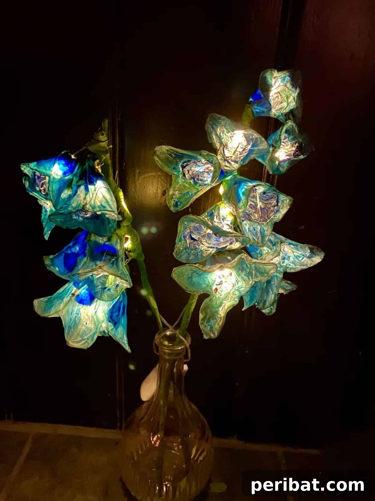 Handmade bluebell flower with LED fairy lights for enchanting indoor decor.