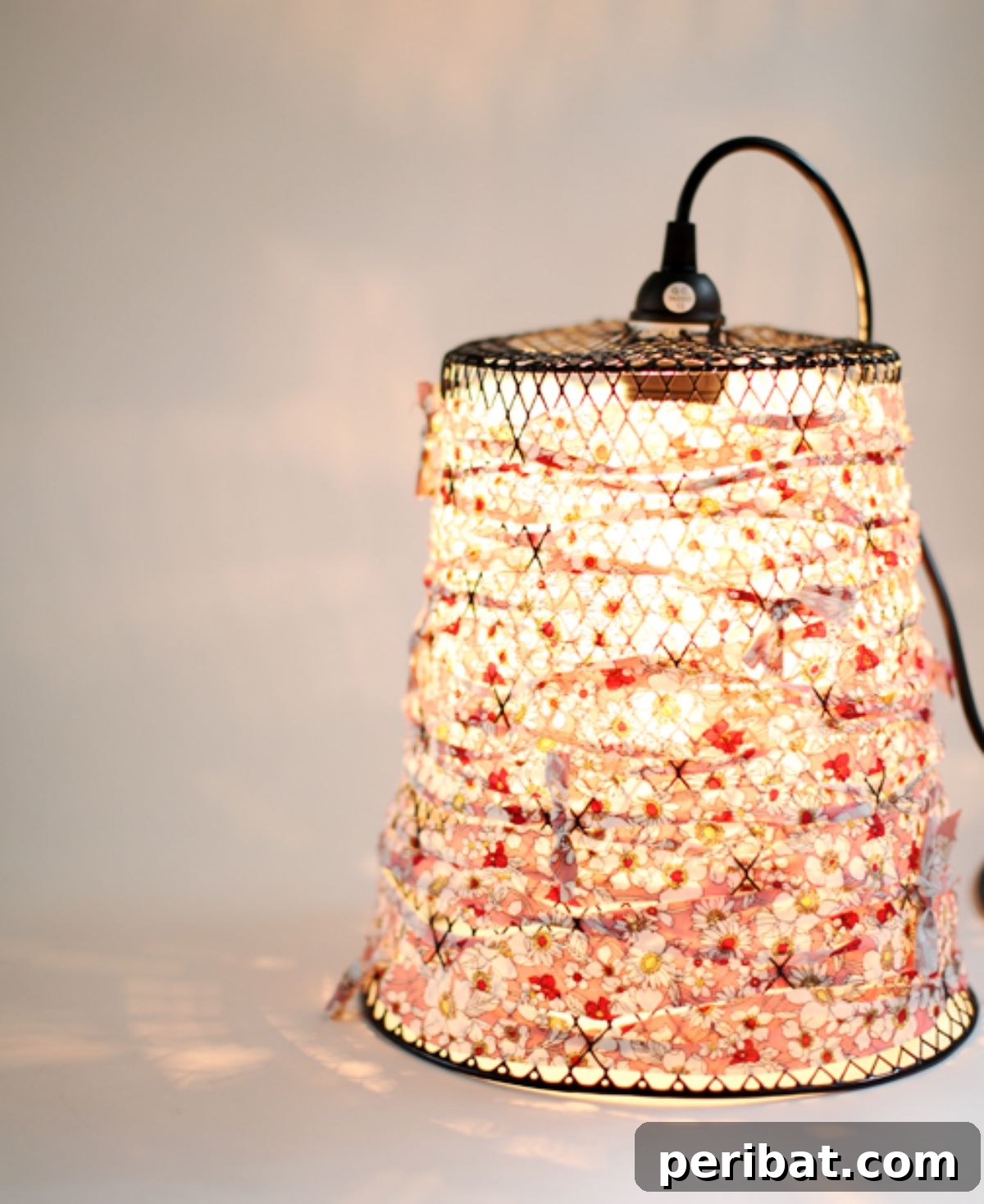 Repurpose a wire waste basket into a unique pendant light.