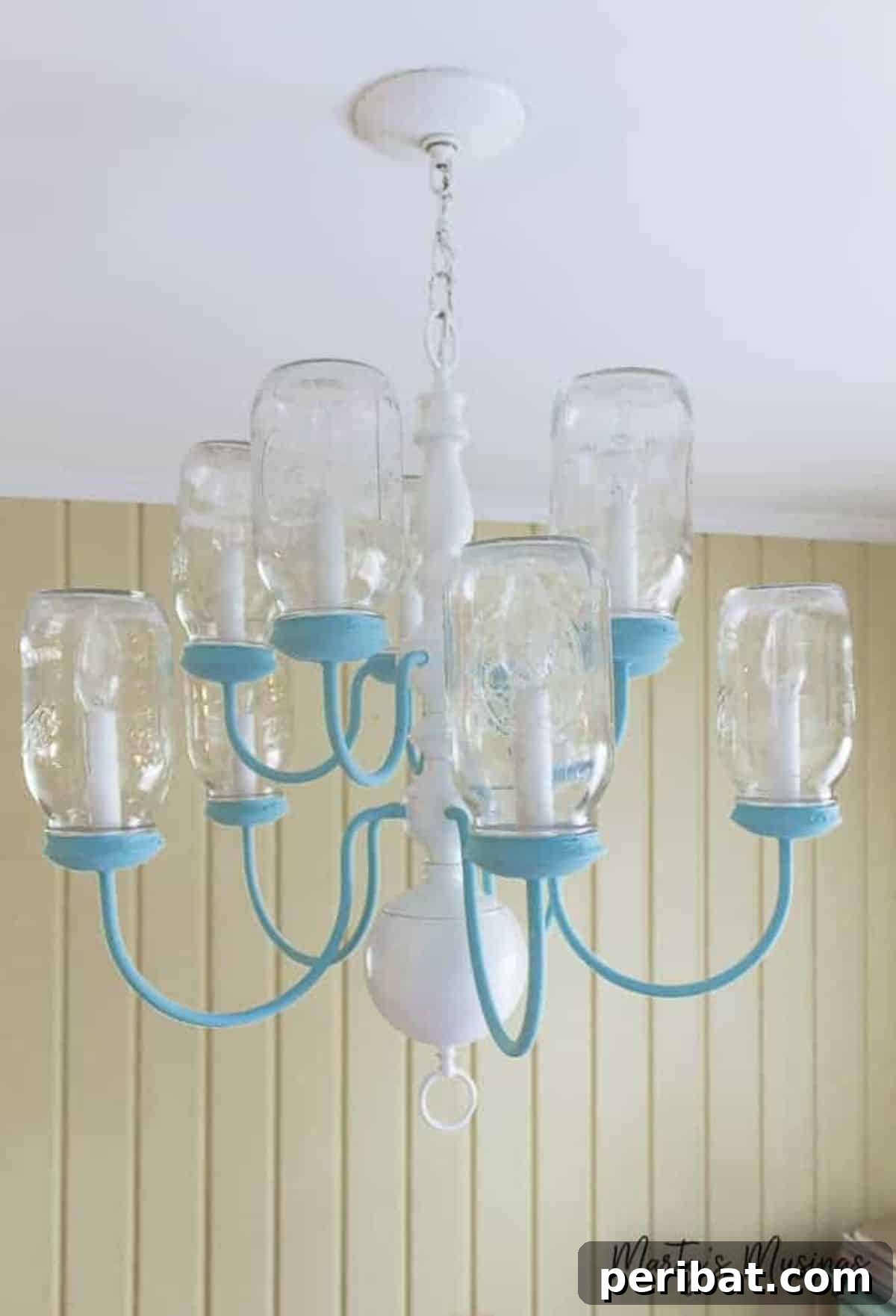 Rustic chic DIY mason jar chandelier for unique indoor lighting.
