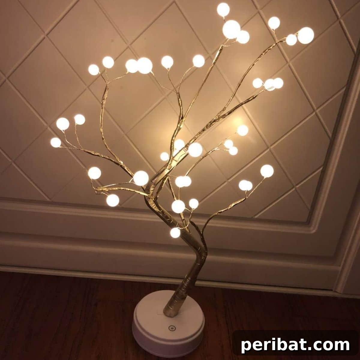 Enchanting DIY LED bonsai tree light for cozy elegant indoor decor.