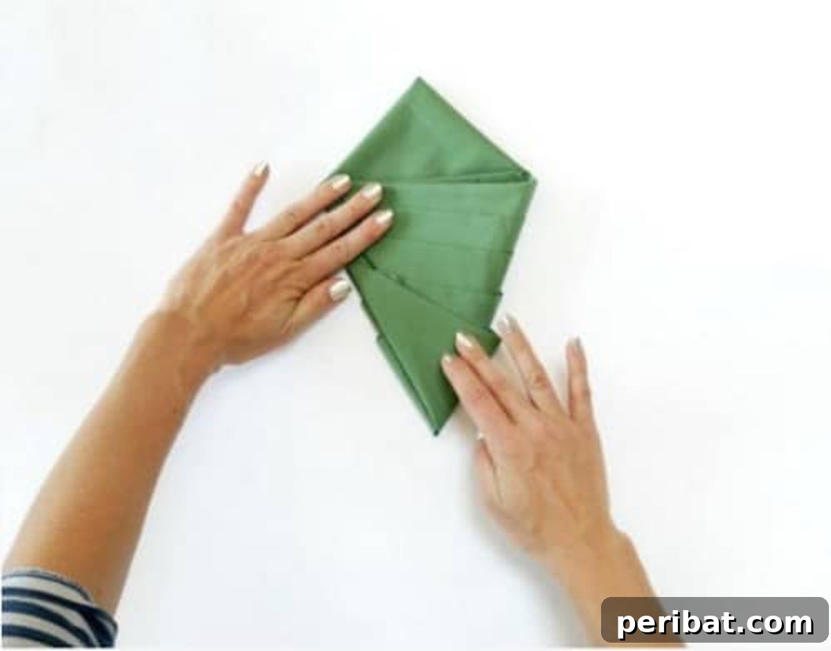 Deck Your Table: Napkins Transform into Christmas Trees 10 Amazing Folding Technique Turns Your Napkins into Christmas Trees - Step 6: Front of the tree shape