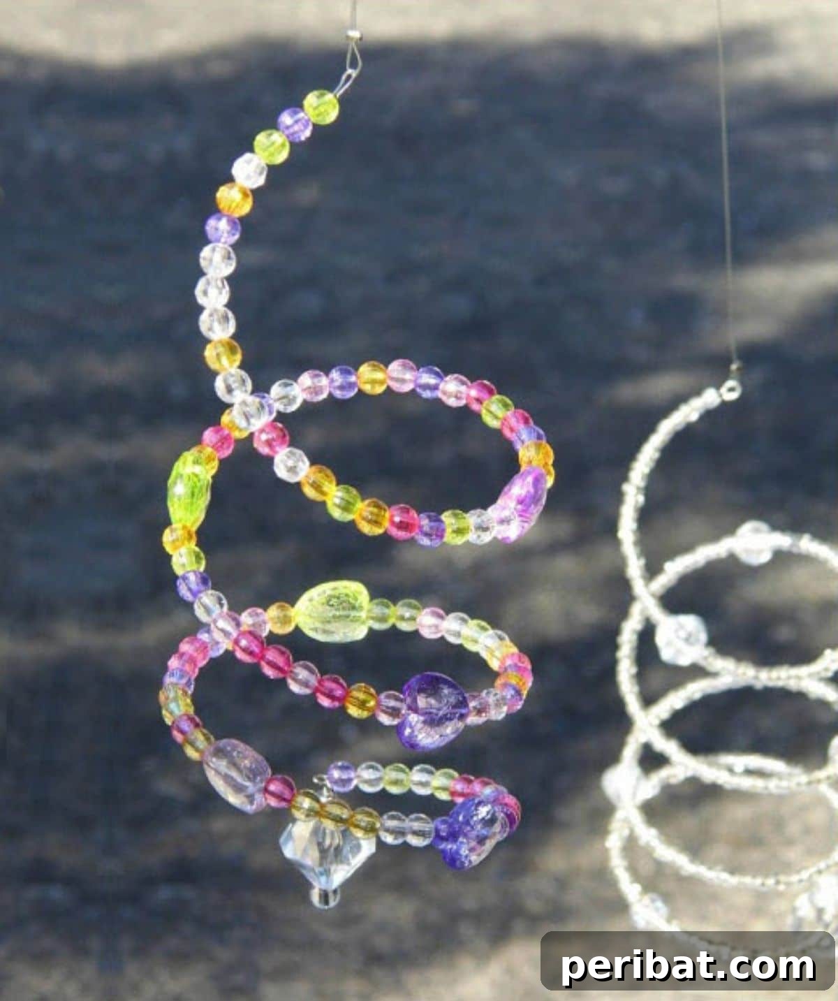 Catch the Light: 50 Unique Sun Catcher Crafts 29 DIY Crystal Spiral Suncatcher