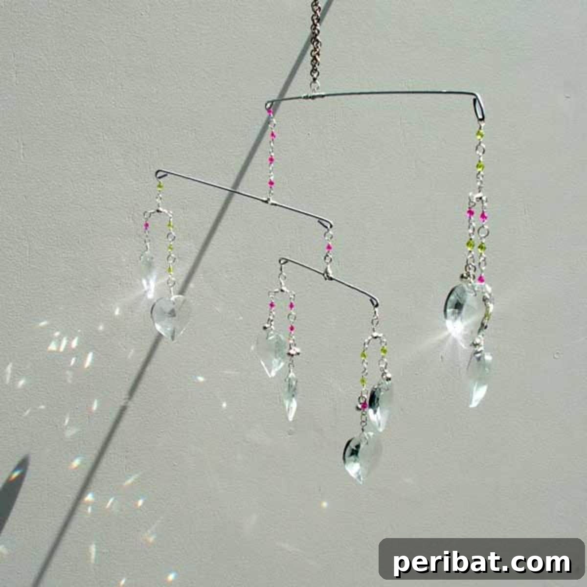Catch the Light: 50 Unique Sun Catcher Crafts 42 DIY Mobile Suncatcher with Heart Crystals