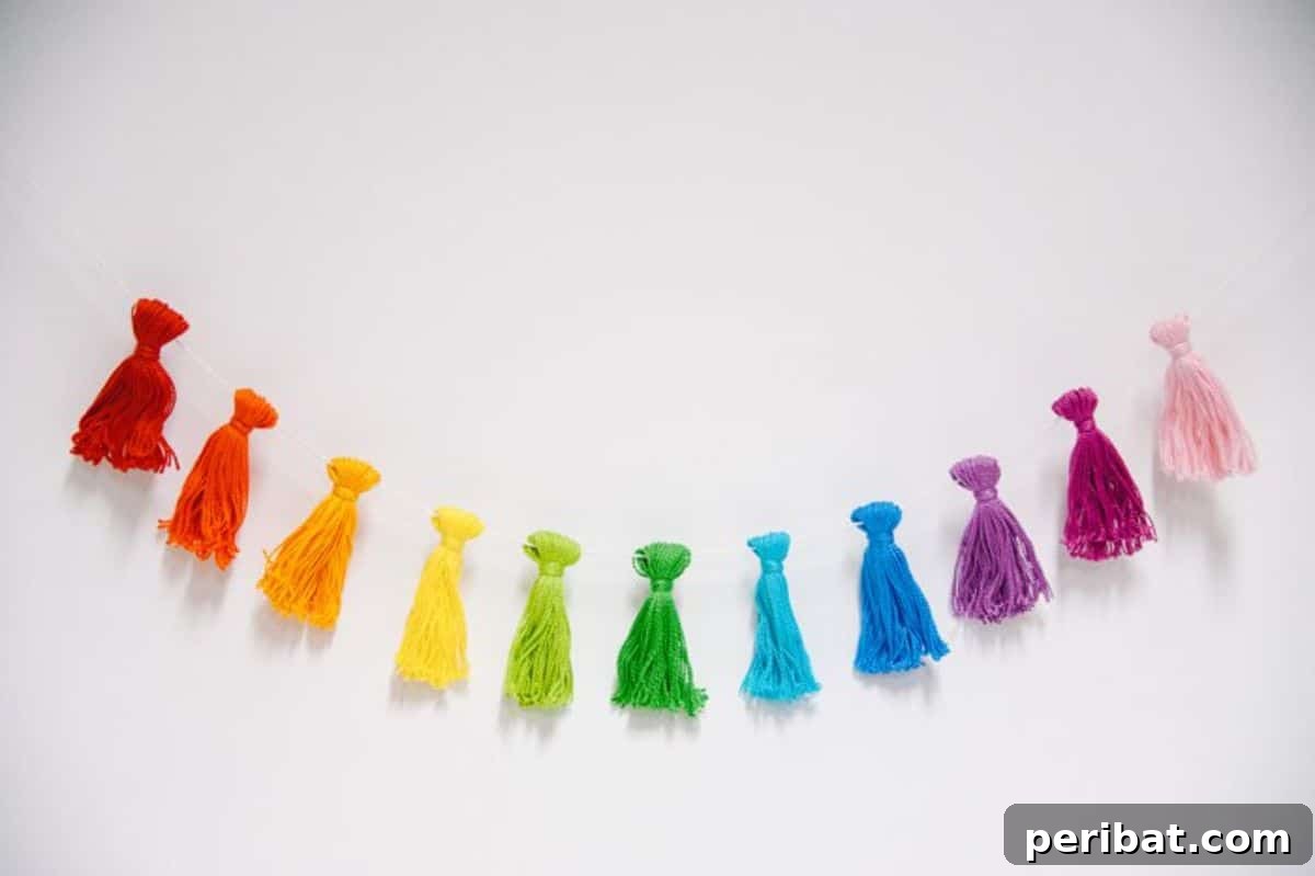 26 DIY Eclectic Decor Ideas to Spark Your Creativity 19 DIY Rainbow Tassel Garland Made With Embroidery Floss