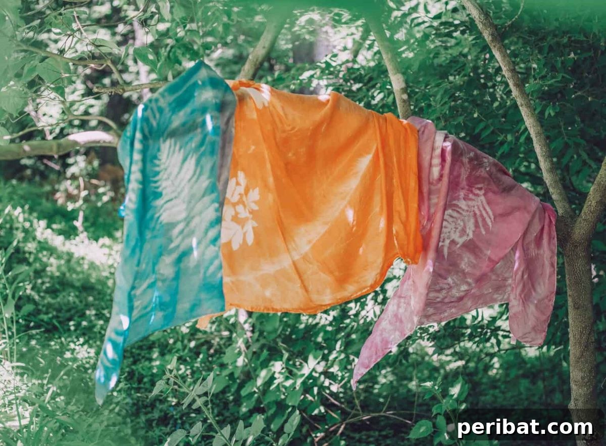 Solar Artistry: 20 DIY Printmaking Ideas 11 Beautiful DIY Sun Print Play Silks displaying abstract blue and white patterns.
