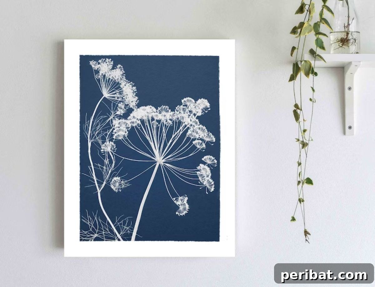 Solar Artistry: 20 DIY Printmaking Ideas 21 Cyanotype Print - Flowers on Navy Blue Background featuring elegant floral designs.