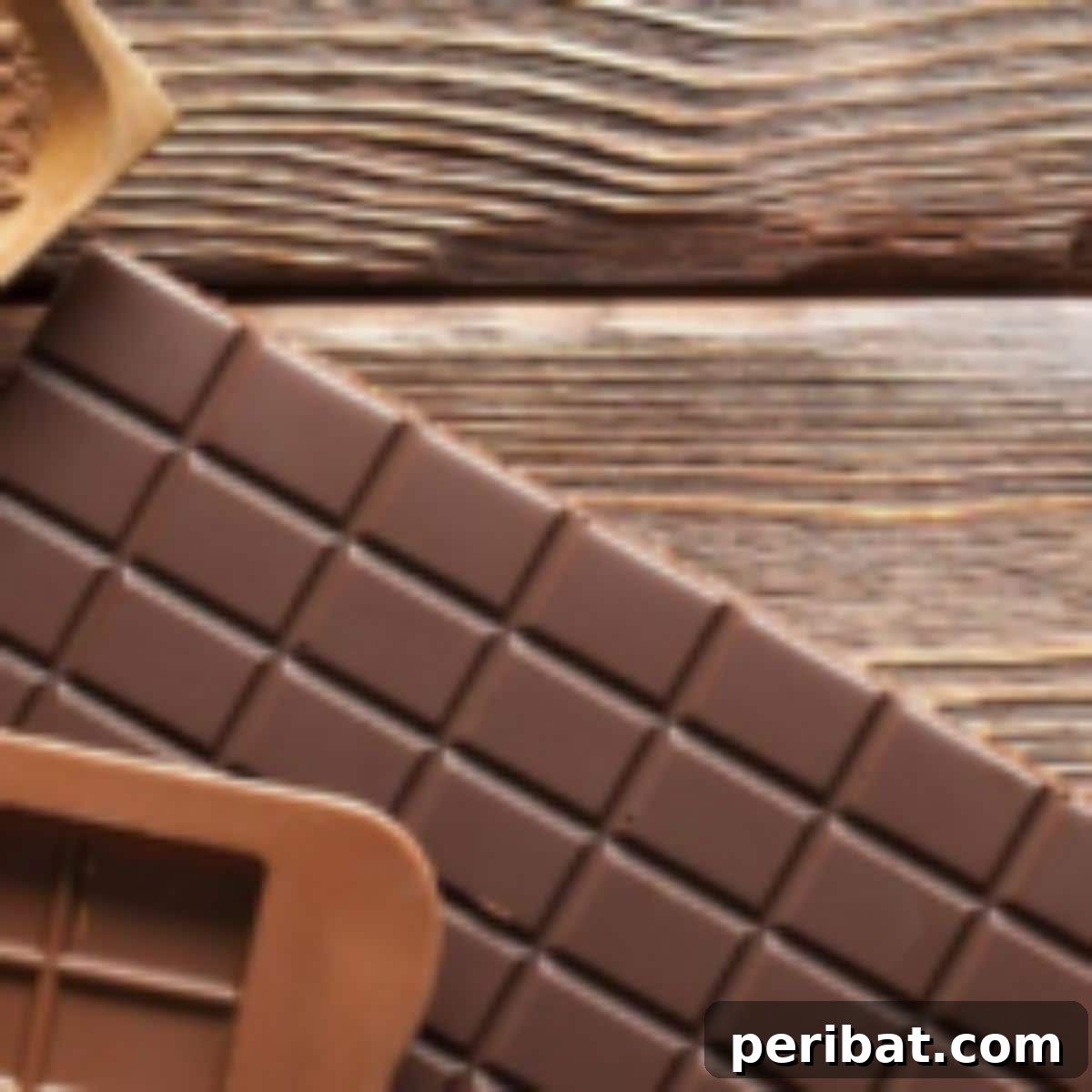 25 Delicious DIY Chocolate Kit Projects 3 Ingredients and process for making homemade chocolate from scratch, showing cocoa beans, butter, and melted chocolate in a bowl.