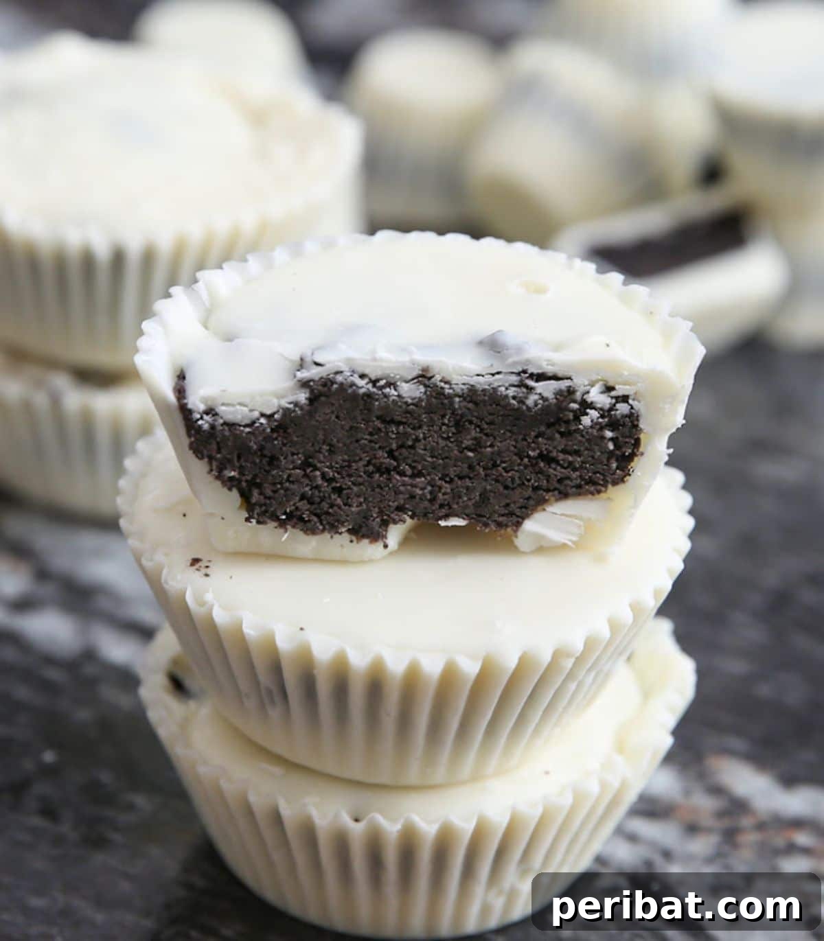 25 Delicious DIY Chocolate Kit Projects 24 Irresistible cookies and cream chocolate candy cups with a visible crumbly texture.