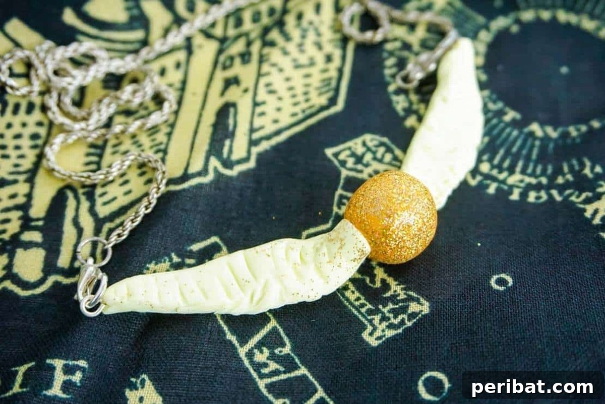52 Inspiring DIY Necklace Ideas and Kits for Stunning Handmade Jewelry 37 magical golden snitch necklace on a towel, inspired by Harry Potter