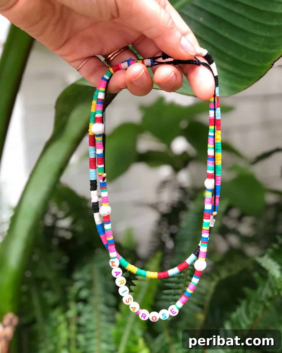 52 Inspiring DIY Necklace Ideas and Kits for Stunning Handmade Jewelry 9 hand holding two vibrant color blocked disk beaded necklaces