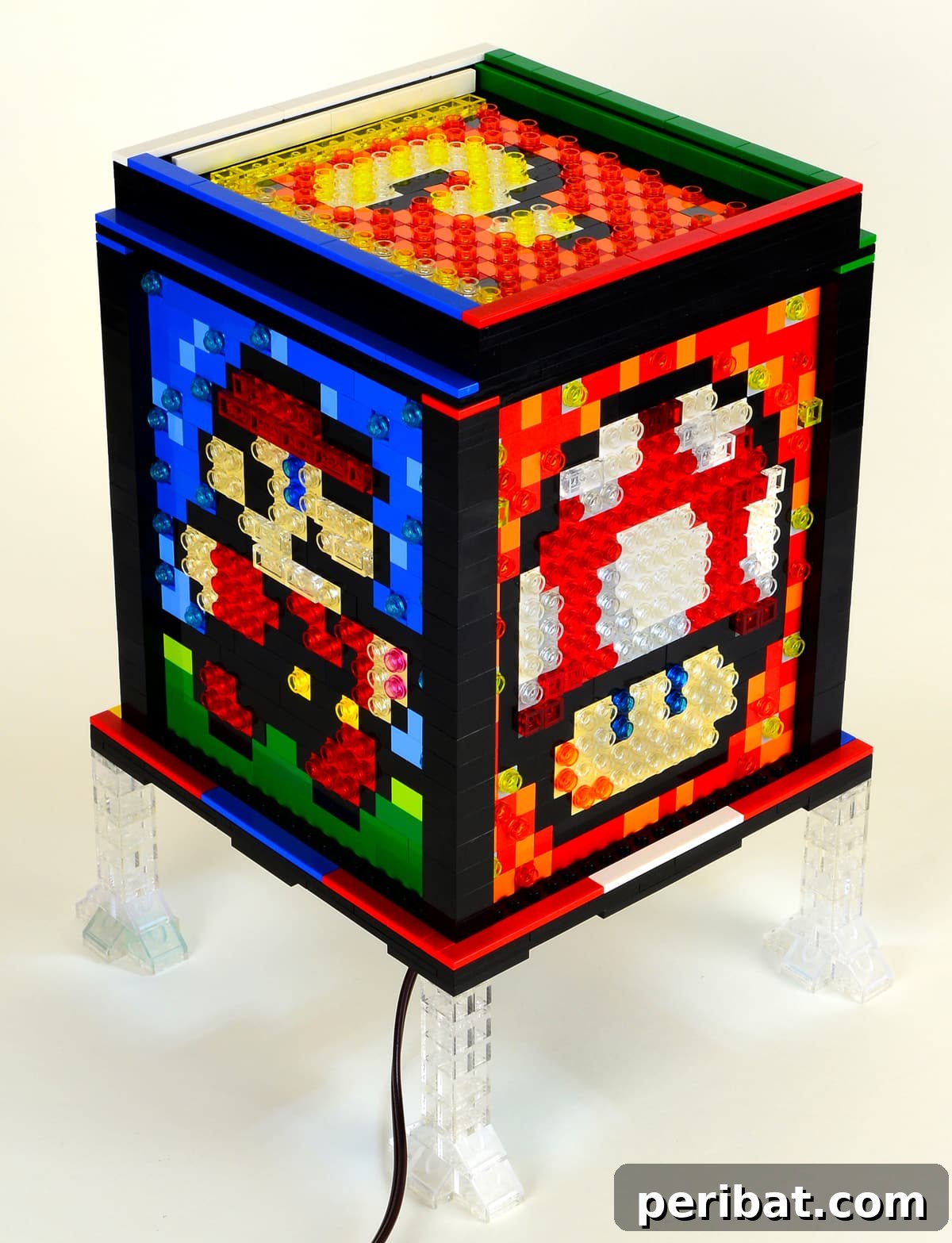 Captivating bedazzled mosaic LEGO sprite lamp, a lighthearted DIY project perfect for introducing a playful element into a room's ambiance.