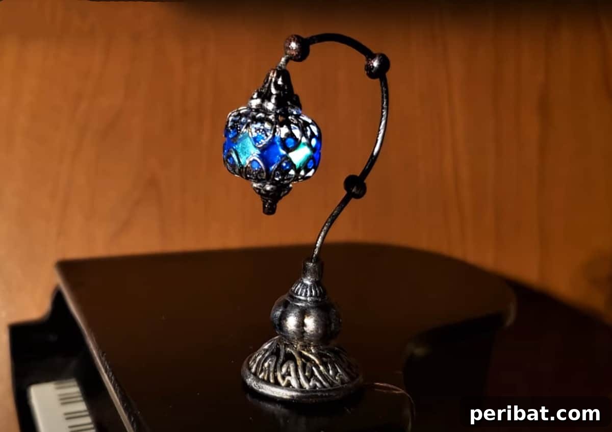 Miniature mosaic lamp placed on a piano, a delightful addition to miniature settings, offering artistry and charm.