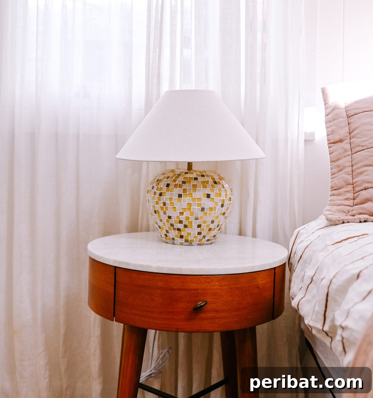 Upcycled mosaic lamp beautifully placed on a bedside table, adding a delightful splash of color and personal flair.