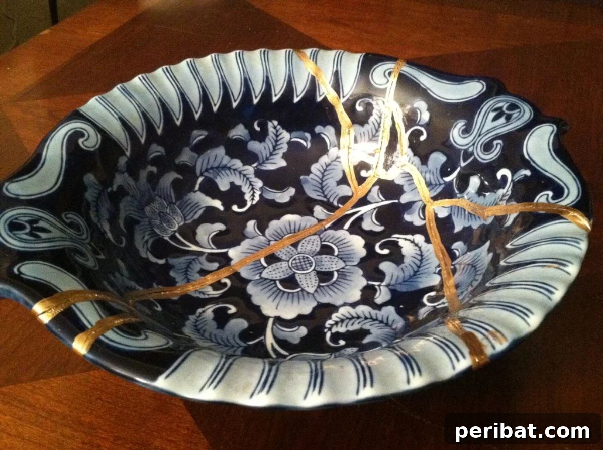 21 DIY Kintsugi Kits: Discover the Art of Golden Mending 12 DIY Faux Kintsugi repaired bowl, demonstrating an affordable method to upgrade old ceramic pieces with golden lines.