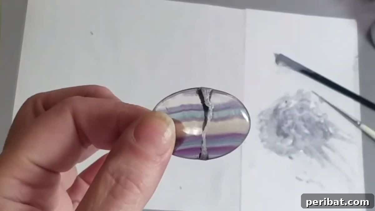 21 DIY Kintsugi Kits: Discover the Art of Golden Mending 23 Gemstone repaired with Kintsugi method, showcasing a unique application of the art for jewelry restoration.