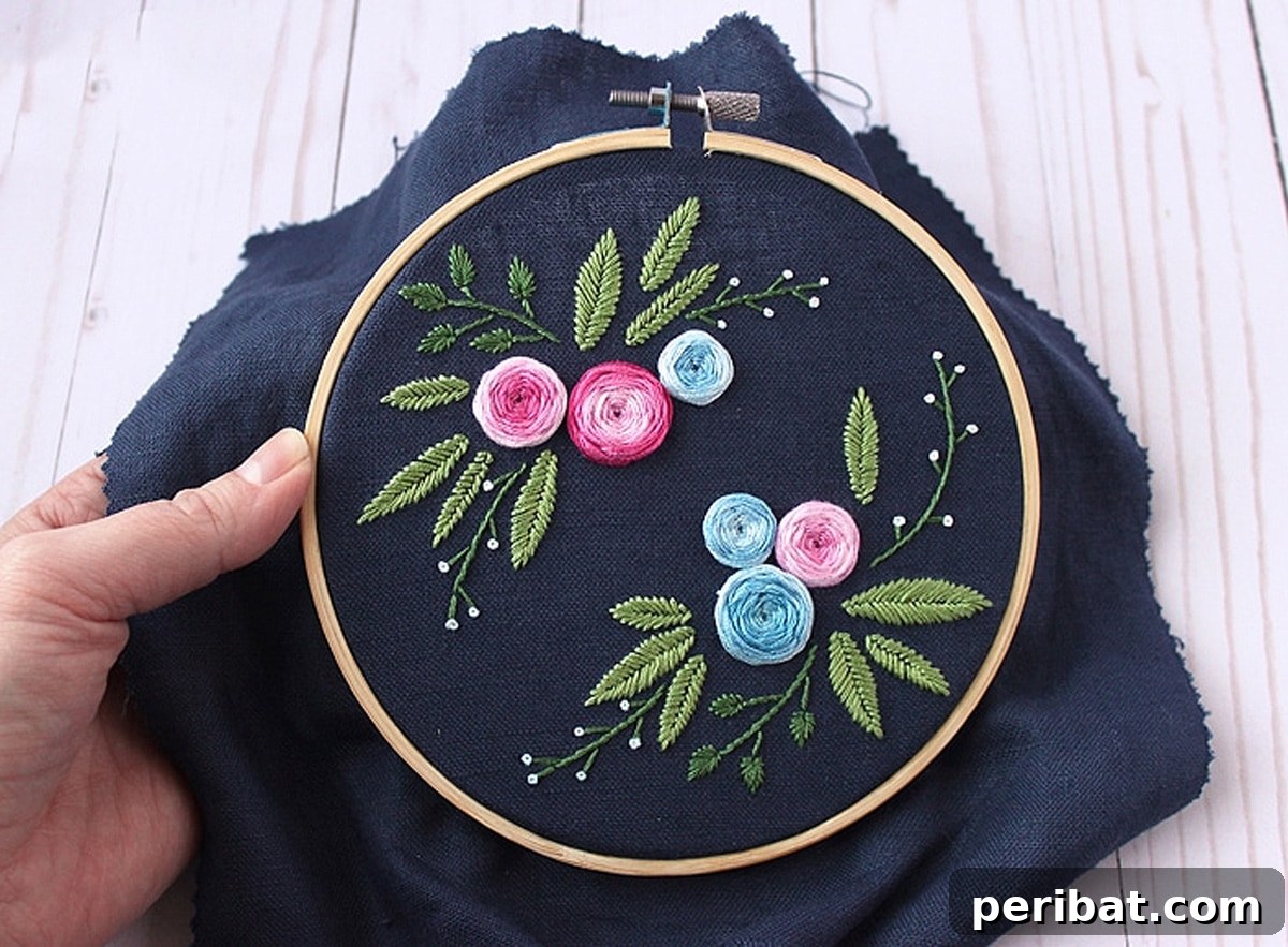 Creative DIY Floral Embroidery Ideas and Projects 20 Elegant blue floral embroidery pattern on dark linen, showcasing depth and beauty with color variation floss