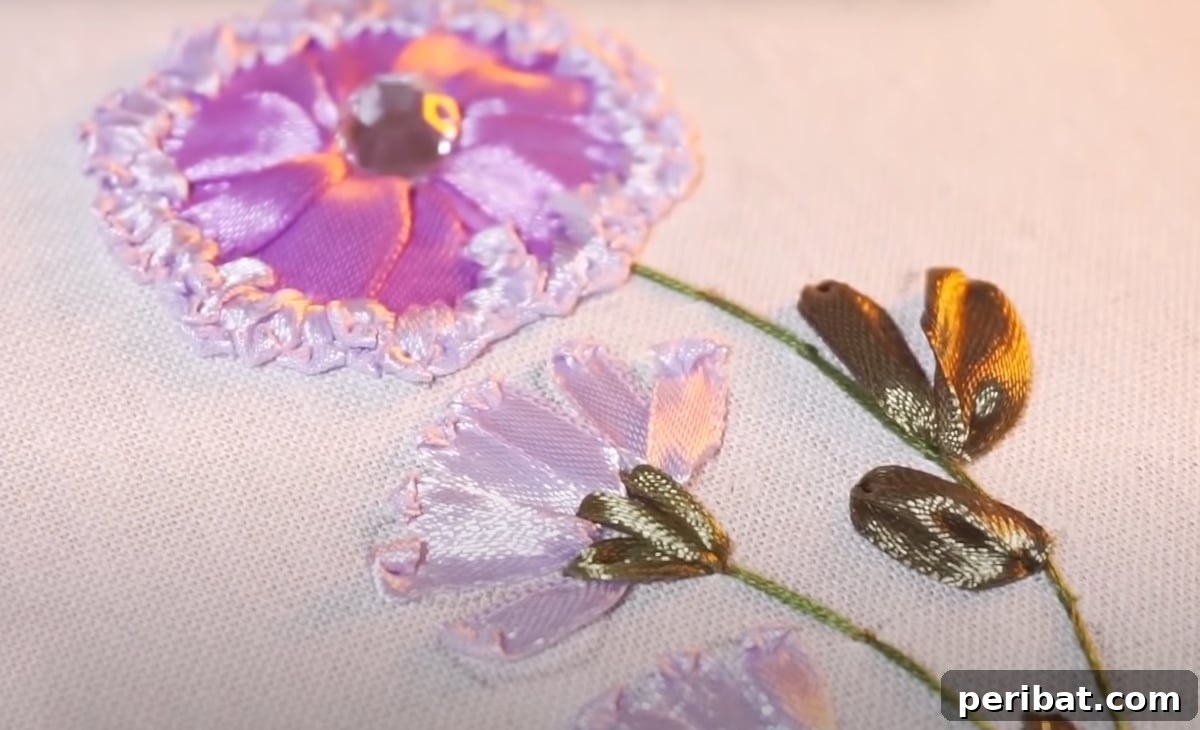 Creative DIY Floral Embroidery Ideas and Projects 25 Exquisite embroidered ribbon flower design, showcasing a rich mix of colors and textures
