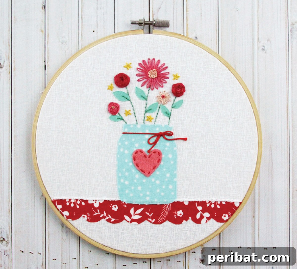 Creative DIY Floral Embroidery Ideas and Projects 26 Charming flower vase embroidery pattern featuring a mason jar, beautifully displayed on a wooden table