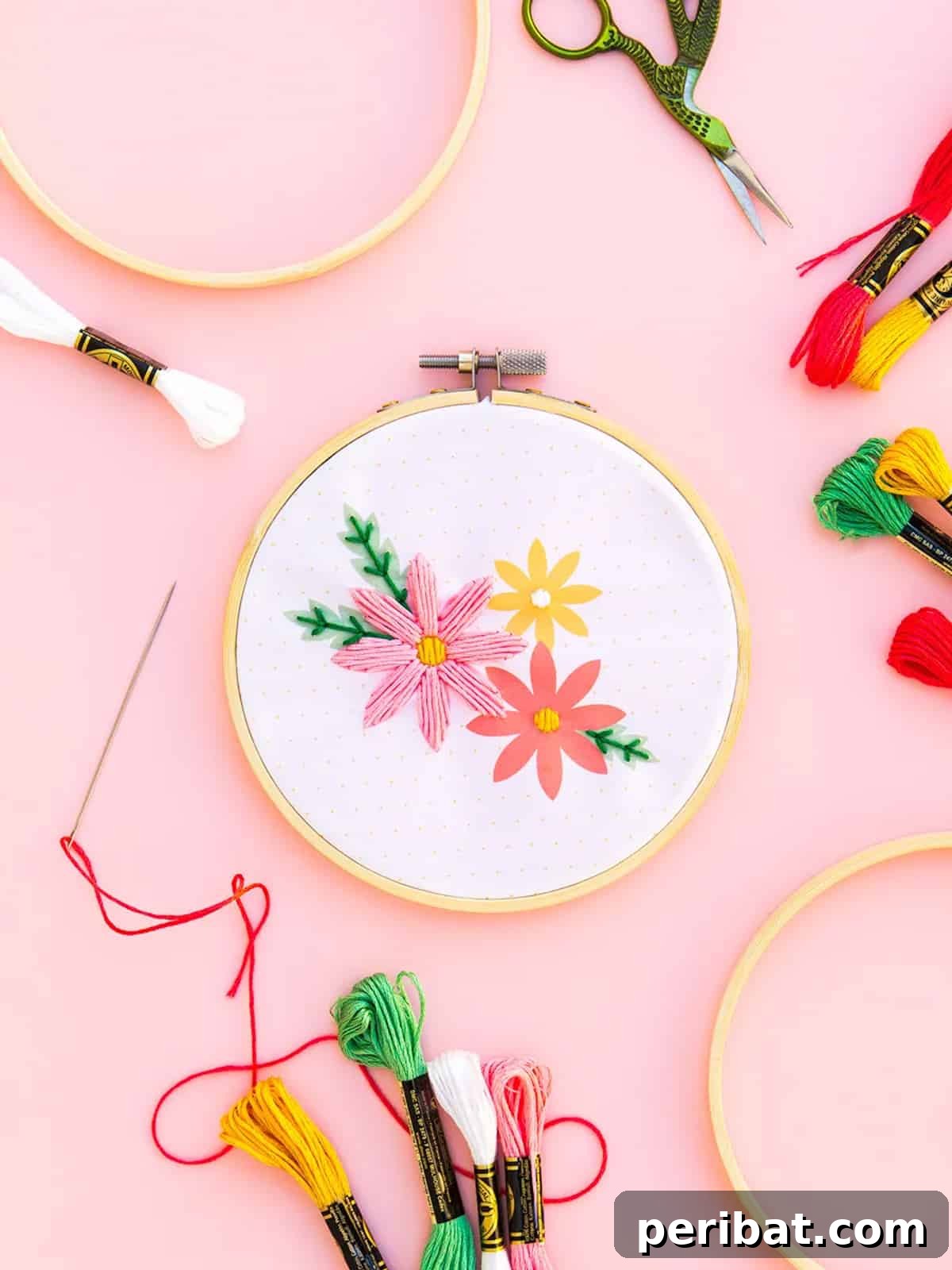 Creative DIY Floral Embroidery Ideas and Projects 4 Elegant embroidered picture frame with three blossoming floral designs, perfect for a personalized gift