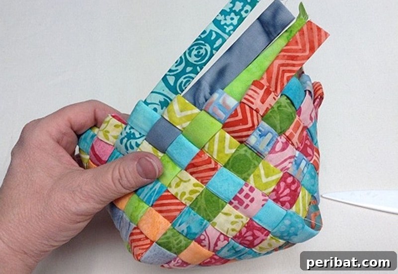 20 Creative DIY Basketry Projects & Kits 9 holding woven fabric basket in hand