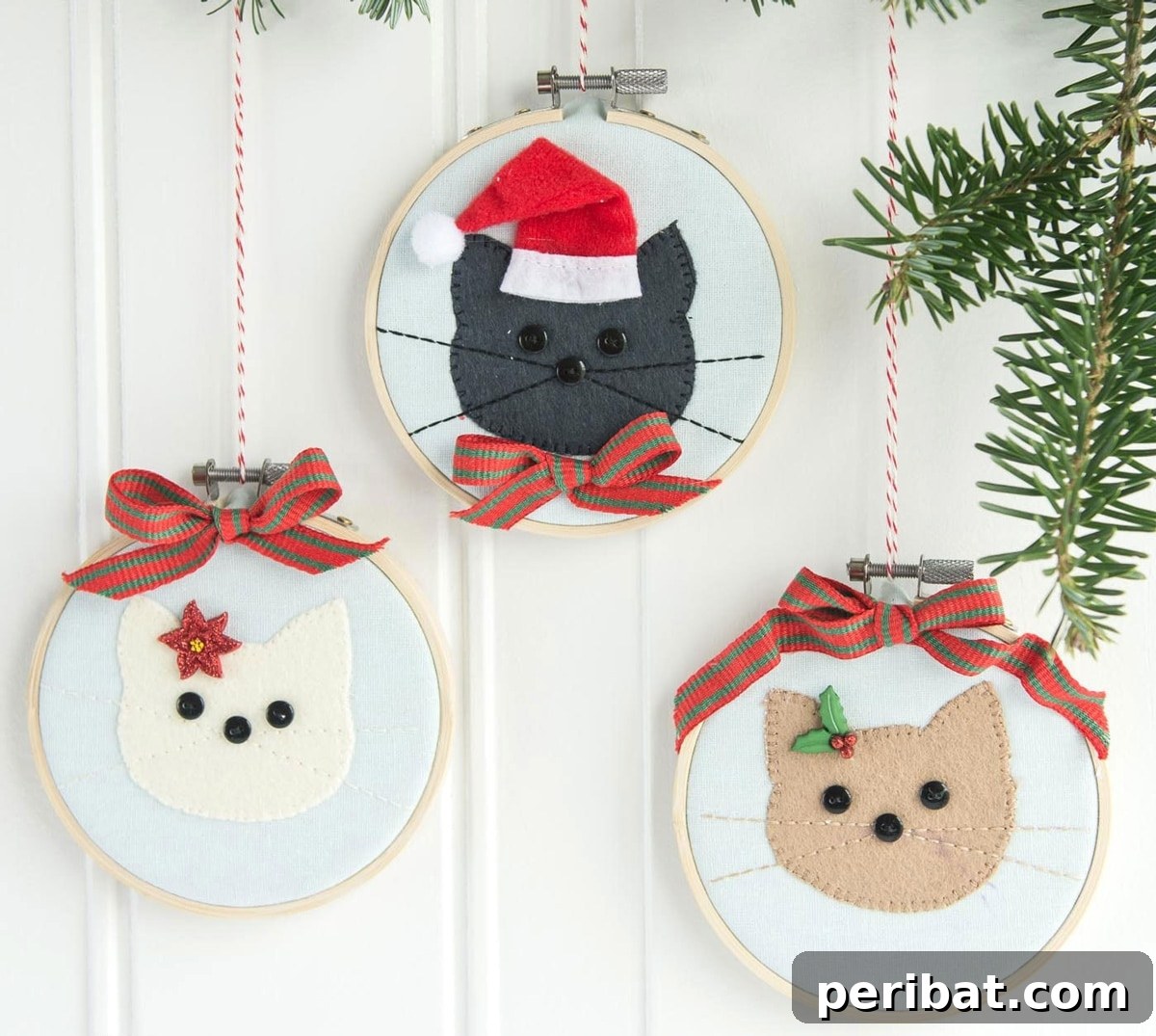 Stitch Your Way to a Merry Christmas: 48 DIY Embroidery Designs 14 Adorable cat embroidery hoop ornaments, perfect for pet-loving households.