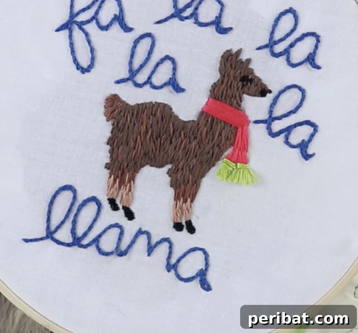 Stitch Your Way to a Merry Christmas: 48 DIY Embroidery Designs 18 An adorable llama embroidery design, dressed in festive attire for a whimsical holiday touch.