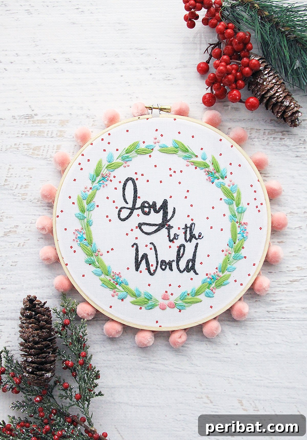 Stitch Your Way to a Merry Christmas: 48 DIY Embroidery Designs 21 A beautifully embroidered 'Joy to the World' hoop, perfect as a festive gift or decor piece.