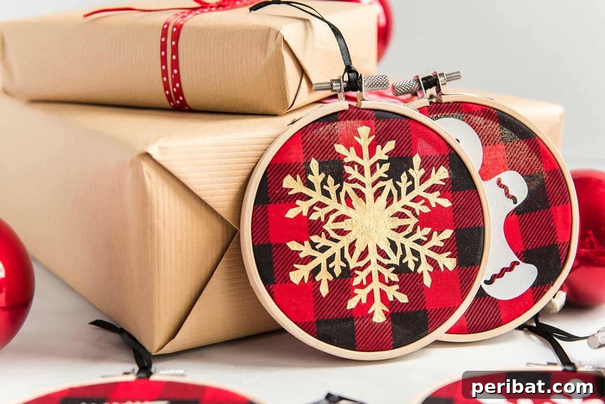 Stitch Your Way to a Merry Christmas: 48 DIY Embroidery Designs 25 Buffalo plaid embroidery hoop ornaments shaped like snowflakes, offering a rustic Christmas aesthetic.