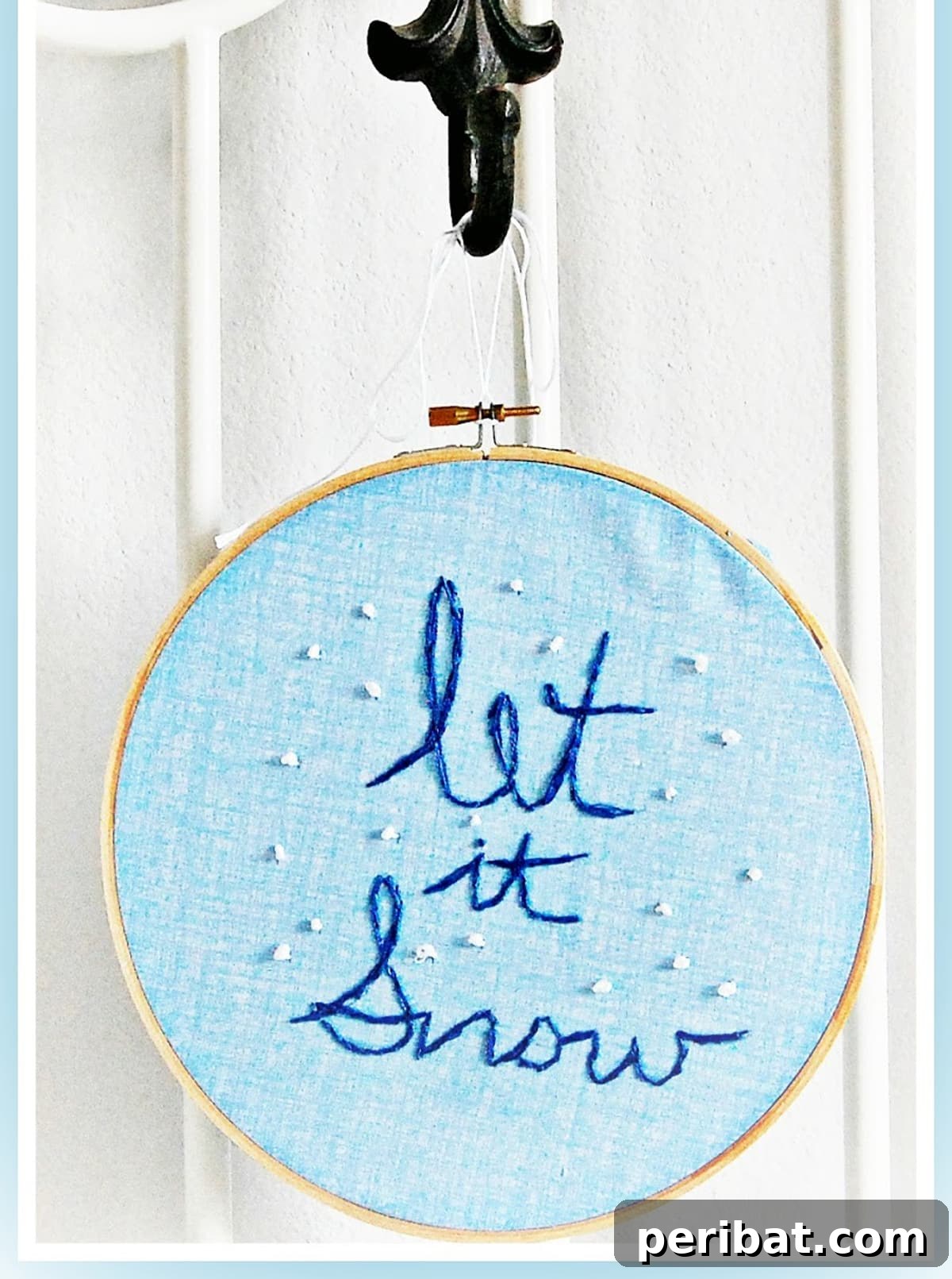 Stitch Your Way to a Merry Christmas: 48 DIY Embroidery Designs 29 A charming 'Let it Snow' embroidery frame, ready to hang and add winter cheer.