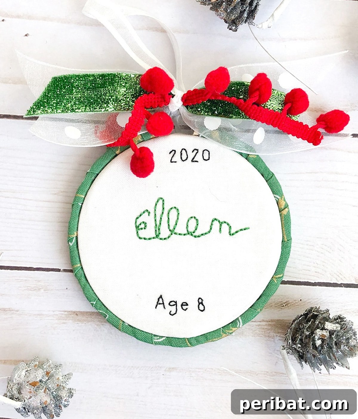 Stitch Your Way to a Merry Christmas: 48 DIY Embroidery Designs 4 A personalized Christmas ornament featuring a child's unique handwriting, hand-embroidered on fabric.