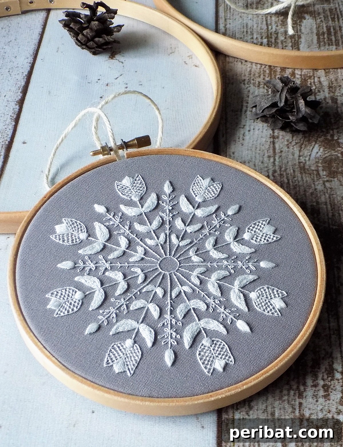 Stitch Your Way to a Merry Christmas: 48 DIY Embroidery Designs 36 An intricate snowflake mandala embroidery pattern, offering a serene crafting experience.