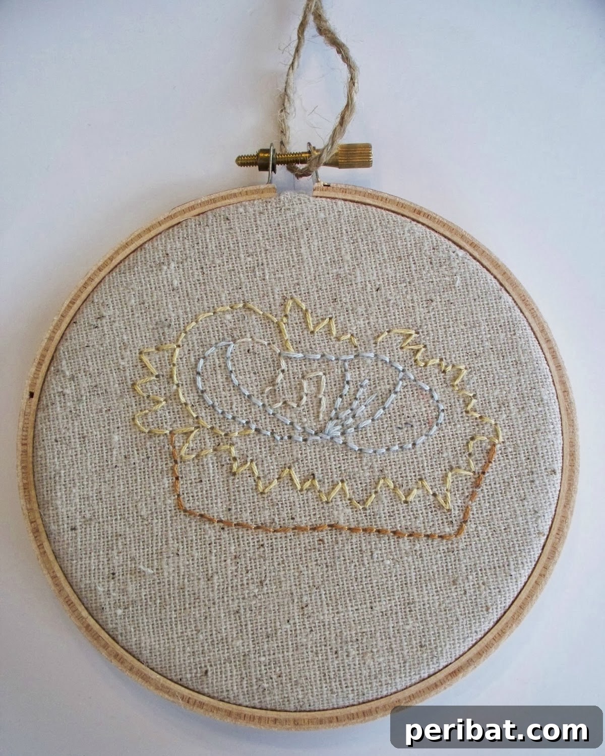 Stitch Your Way to a Merry Christmas: 48 DIY Embroidery Designs 40 A beautifully embroidered mason jar lid ornament, featuring a Baby Jesus design.