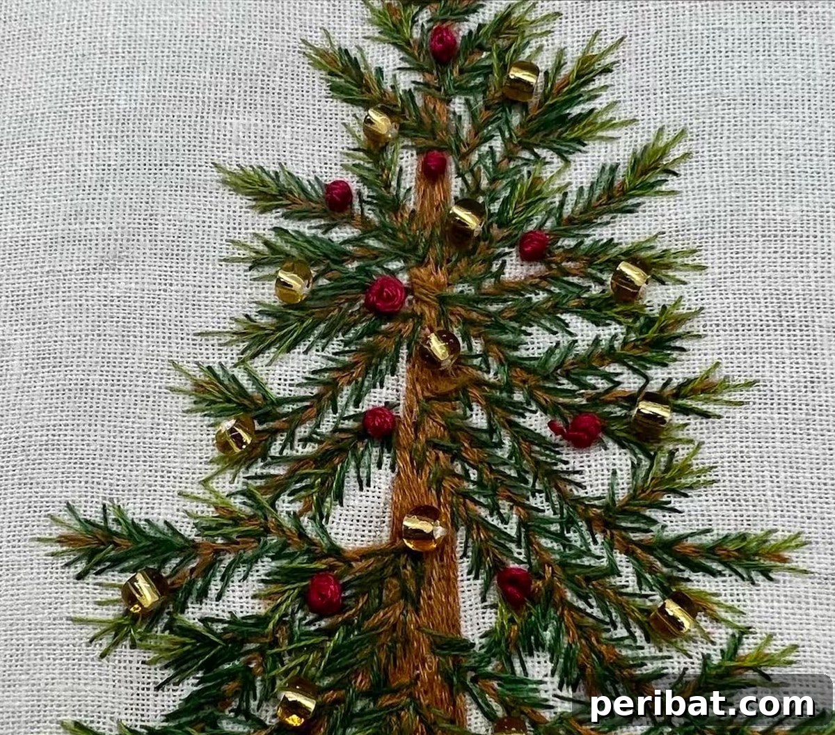 Stitch Your Way to a Merry Christmas: 48 DIY Embroidery Designs 45 A sparkling beaded Christmas tree embroidery, creating a realistic and dazzling art piece.