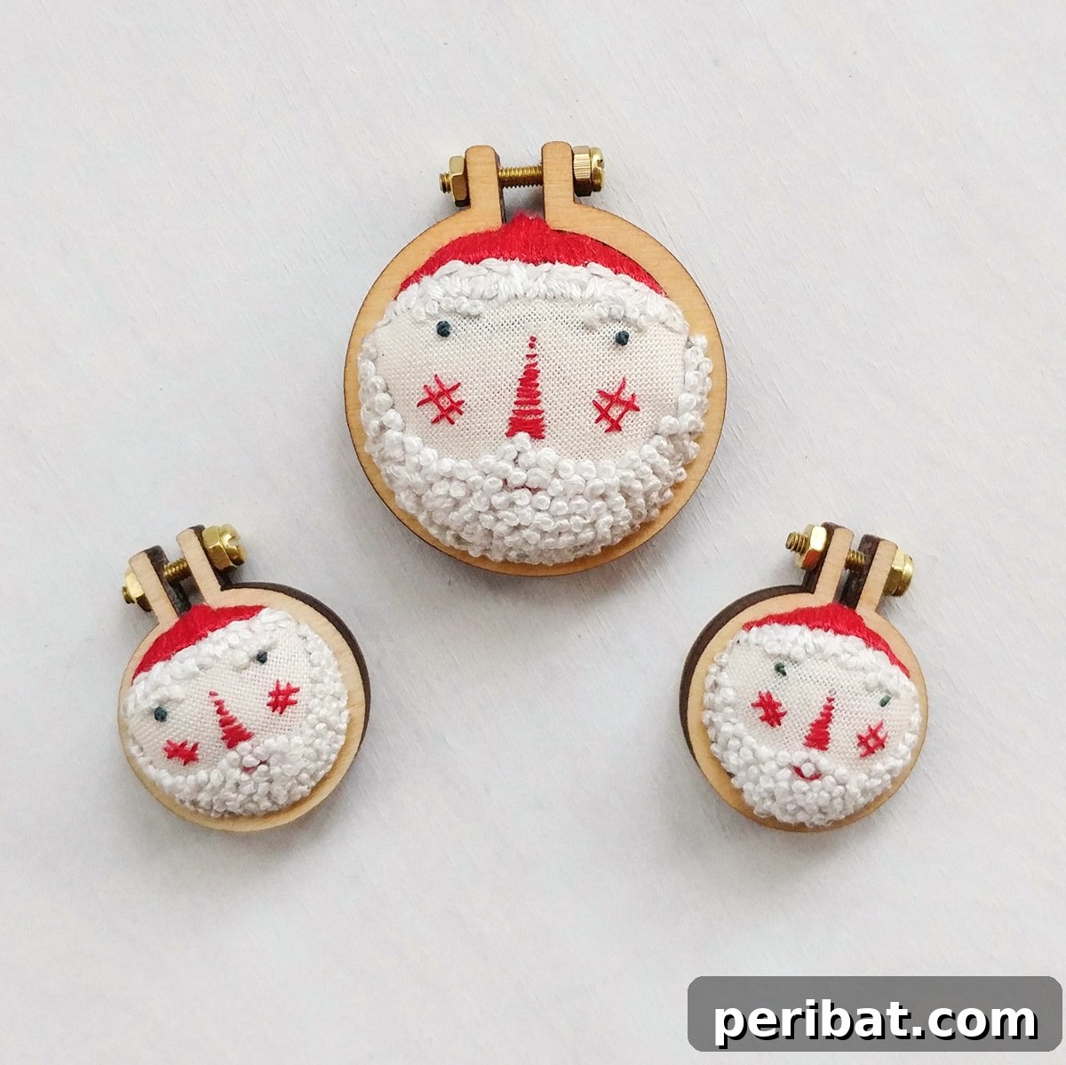 Stitch Your Way to a Merry Christmas: 48 DIY Embroidery Designs 6 Three charming mini Santa embroidery patterns, perfect for small festive accents.