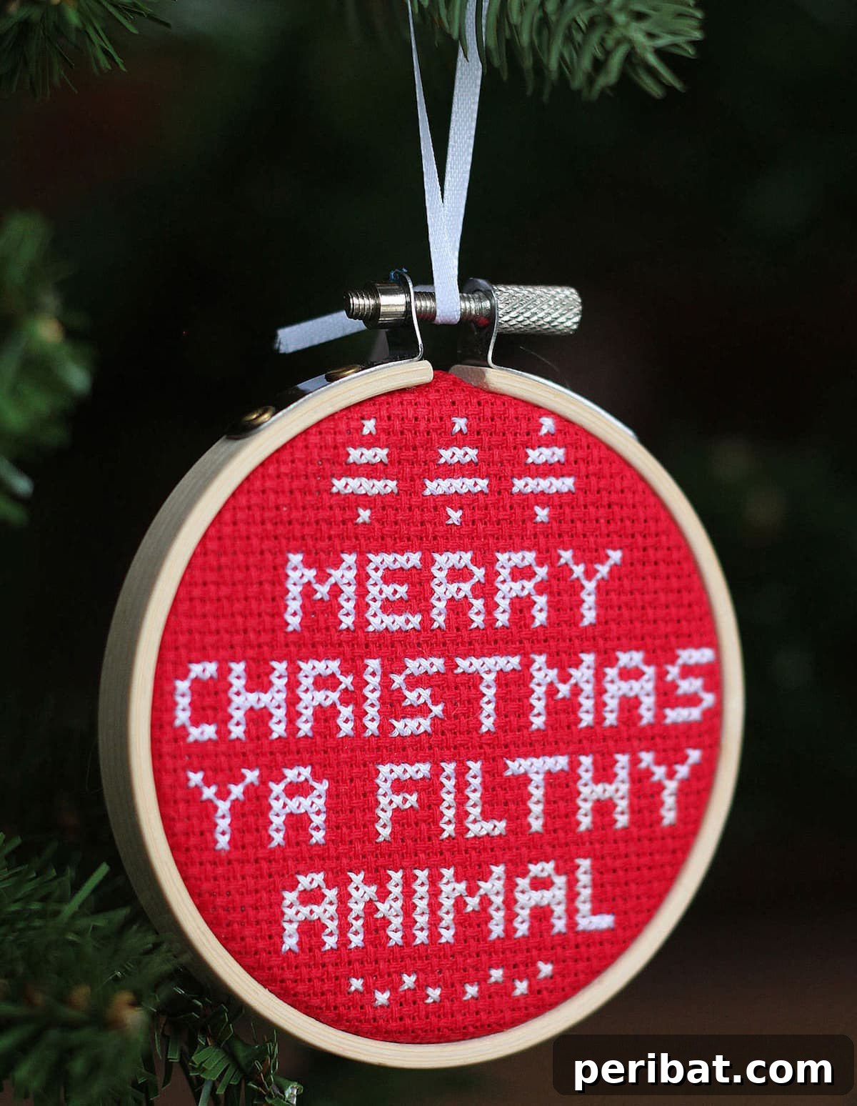 Stitch Your Way to a Merry Christmas: 48 DIY Embroidery Designs 9 A festive cross-stitch ornament inspired by the classic movie Home Alone.