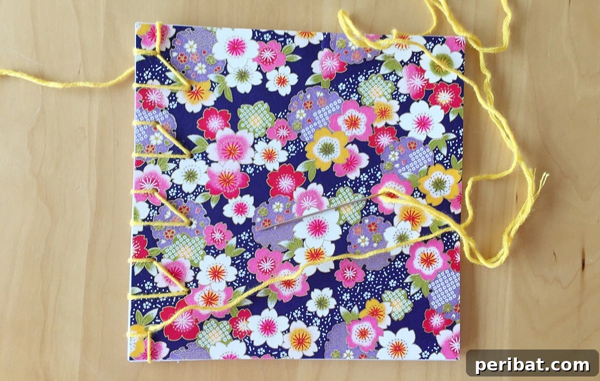 Bind Your Own Books 21 Creative DIY Projects 10 square notebook with floral motifs and embroidery needles