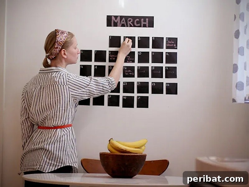 Writing on a DIY chalkboard wall calendar