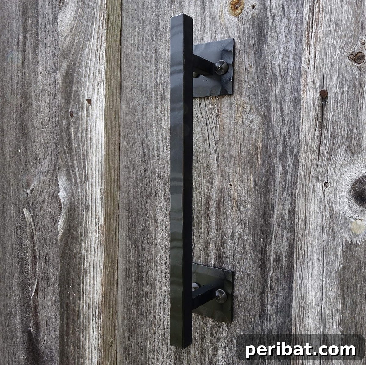 Rustic black barn door handle pull with a textured finish.