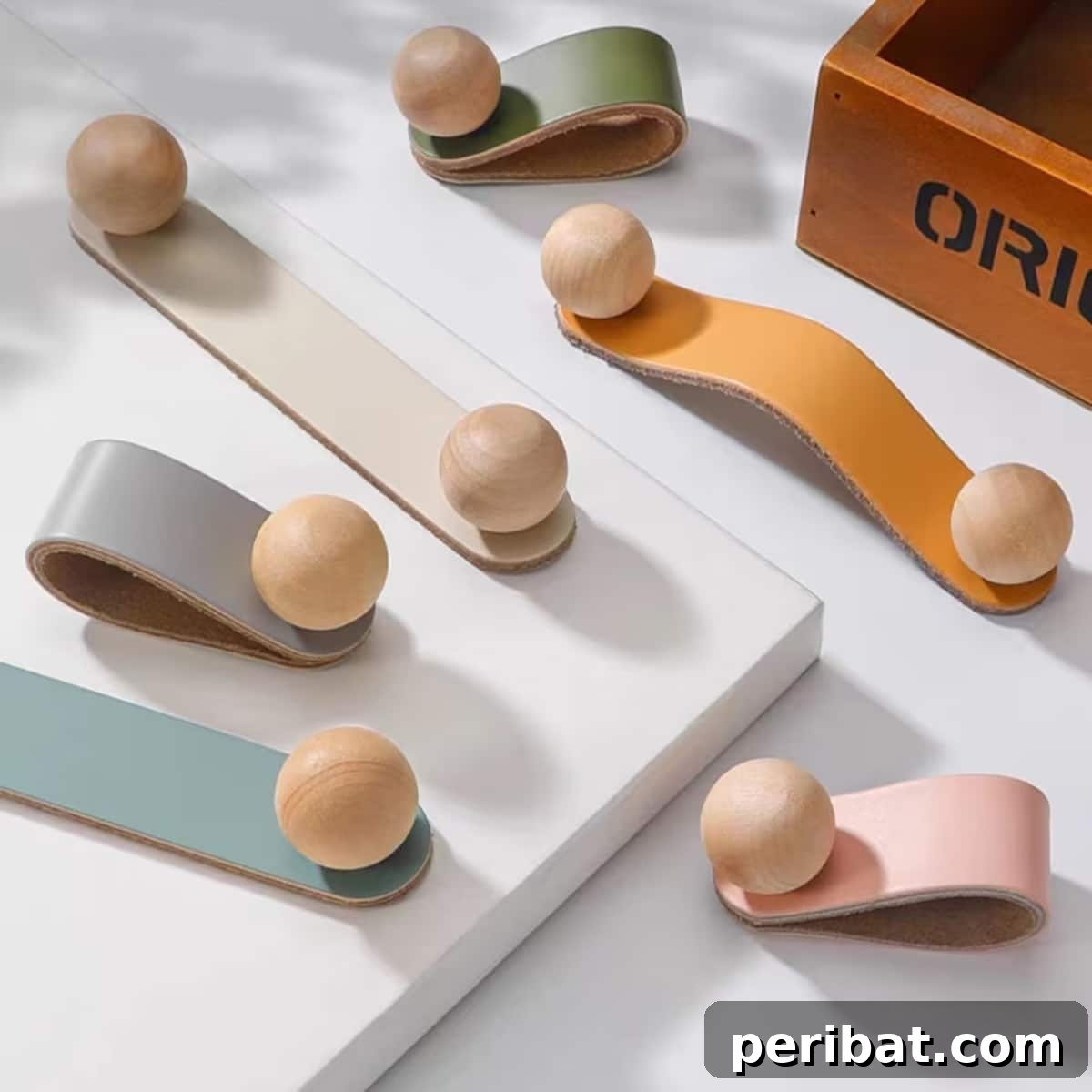 Creative handmade leather cabinet door handles in various vibrant colors.