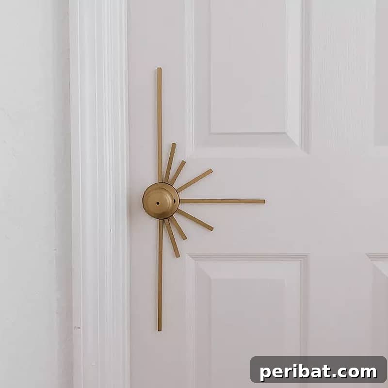 A dazzling sunburst door knob made from mirrored or metallic pieces.