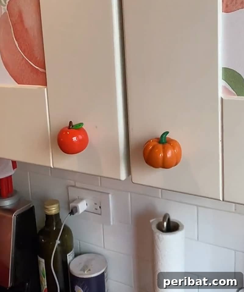 Adorable clay fruit door knobs shaped like strawberries and lemons.