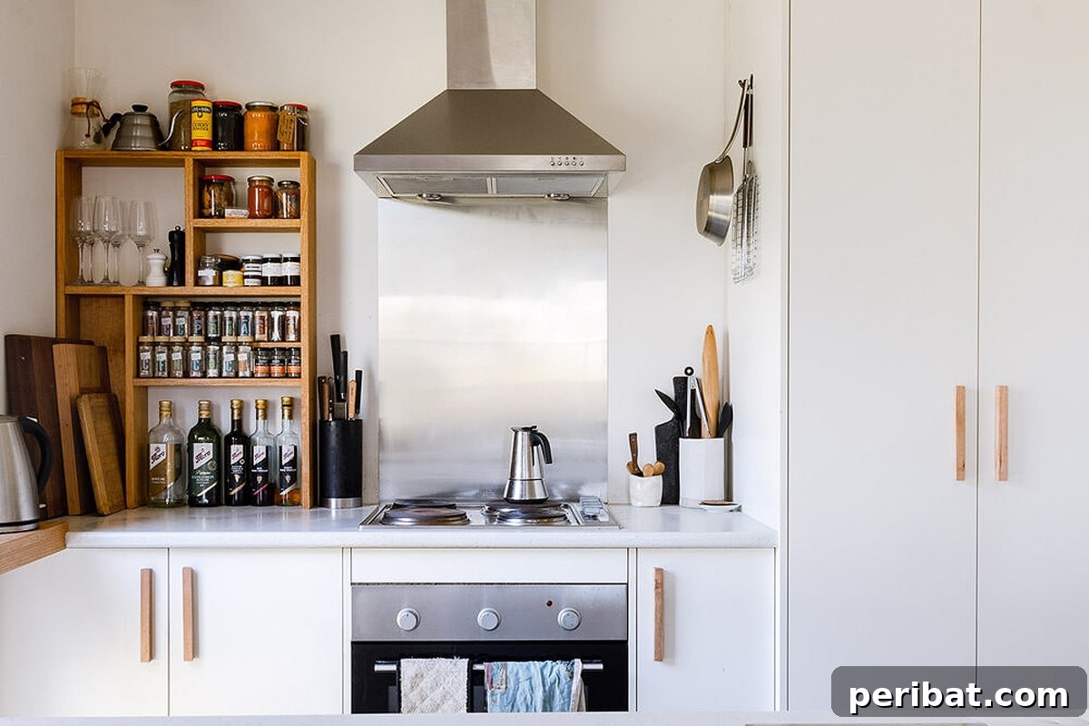 Modern timber door handles installed in a contemporary kitchen.