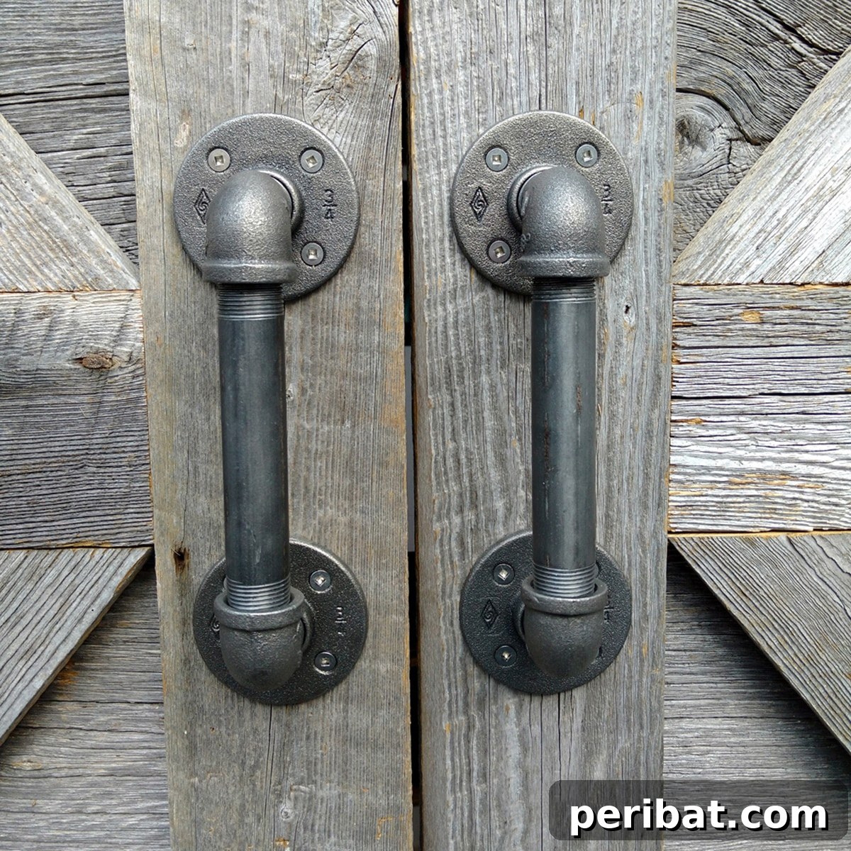 Sturdy DIY door handles crafted from industrial water pipes.